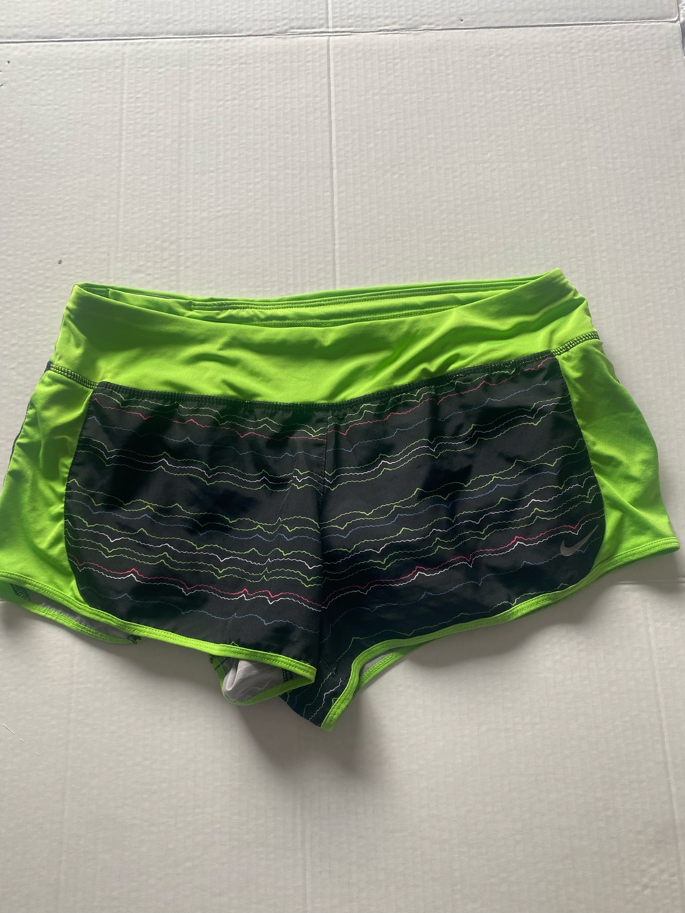 Nike Women's Neon Green Athletic Shorts with Black Patterned Front